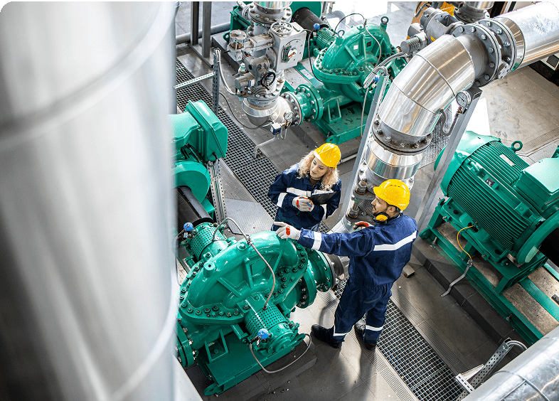Engineers inspecting machinery in an industrial plant.
